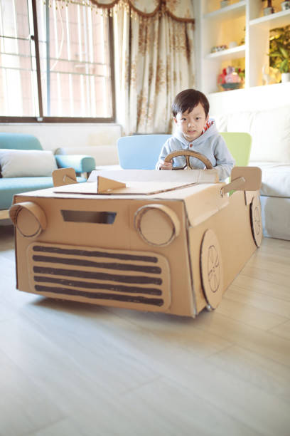 istock Children play in the cardboard car 642388208