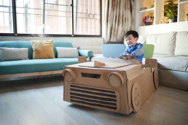 istock Children play in the cardboard car 642388836