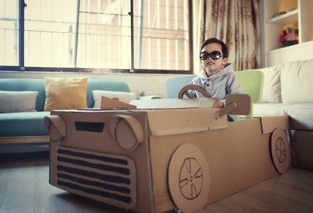istock Children play in the cardboard car 642389082