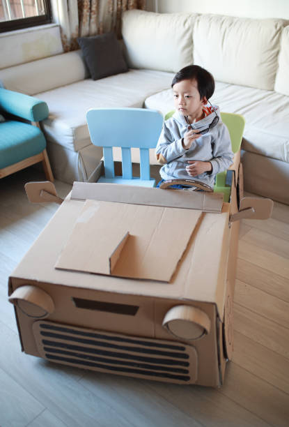 istock Children play in the cardboard car 642389128