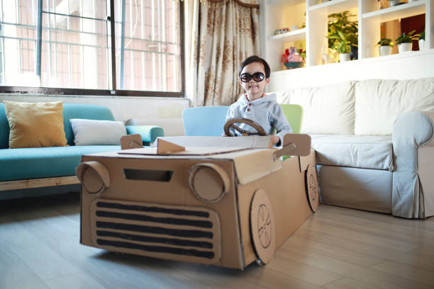 istock Children play in the cardboard car 642389218