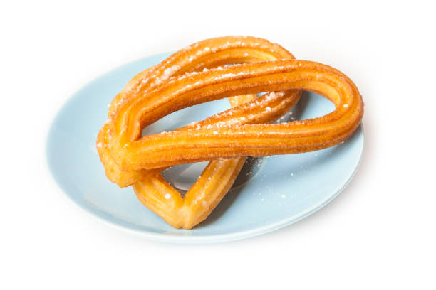istock Churros, traditional Spanish breakfast food, on white background 642395244