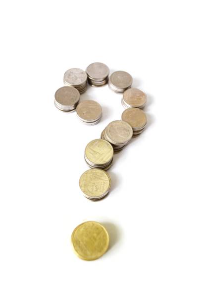 istock Question mark by rows of coins on white background 642398014