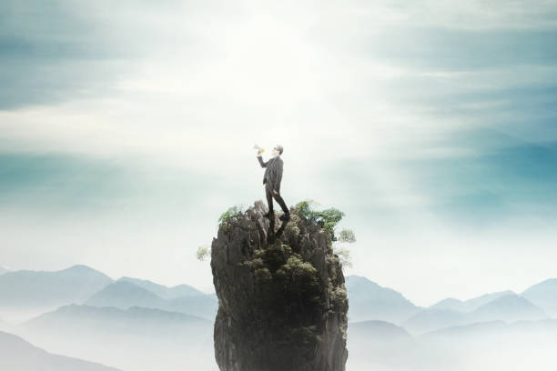 istock Businessman shouting on the peak 642400494