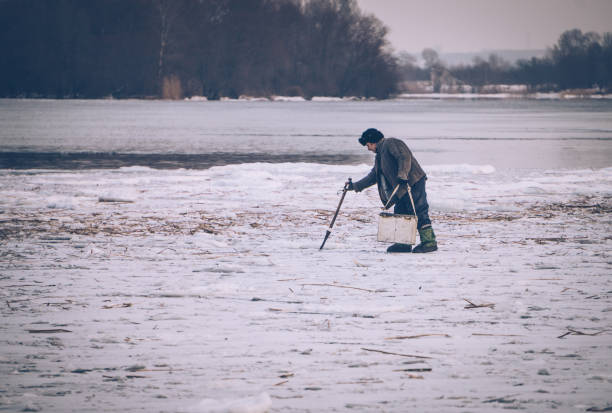 istock Winter fishing on melting ice 642414288