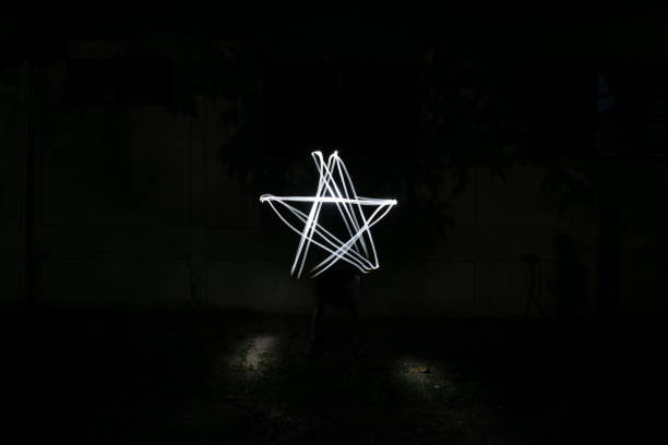 luz da estrela - lighting equipment illuminated isolated on black part of - fotografias e filmes do acervo