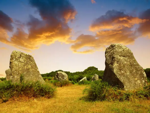 Photo of Megalithic monuments menhirs in Carnac at sunset