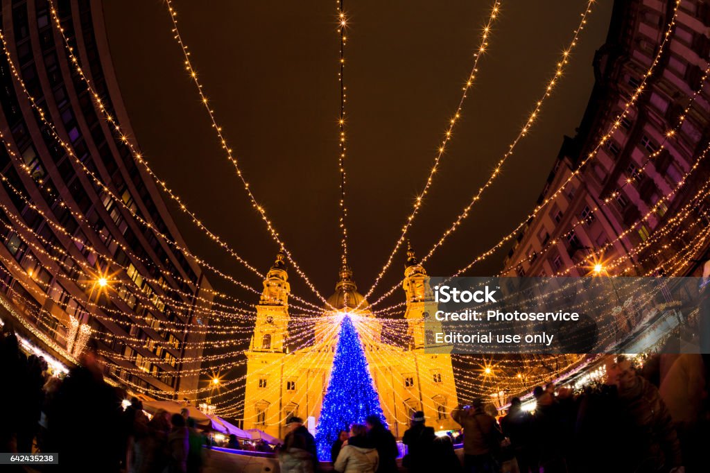 Christmas in Budapest Budapest, Hungary - Dec 19 2015: Tourists enjoy the Christmas lights at the St Steven Basilica in Budapest, Hungary. This traditional Christmas fair attracts abut 900,000 visitors each year from all around the world. Advent Stock Photo Christmas in Budapest Budapest, Hungary - Dec 19 2015: Tourists enjoy the Christmas lights at the St Steven Basilica in Budapest, Hungary. This traditional Christmas fair attracts abut 900,000 visitors each year from all around the world. Advent Stock Photo