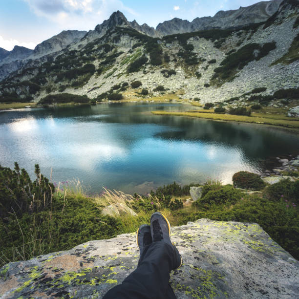 istock Male hiker legs on a rock 642437970