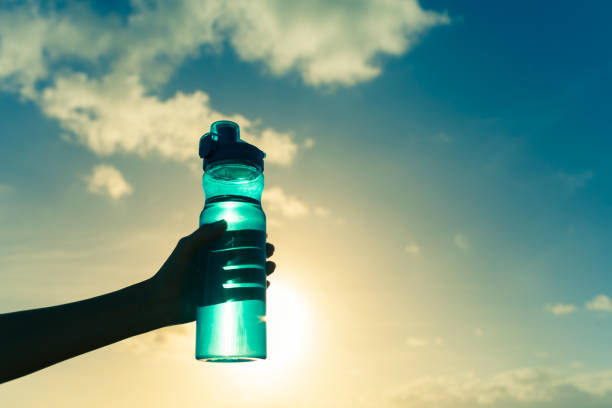 istock Hand holding up bottle of water 642441762