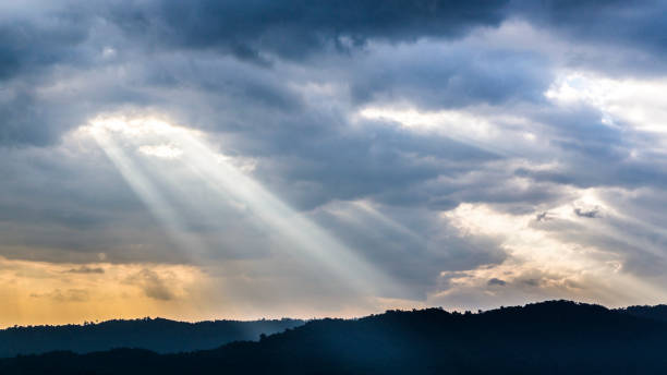 istock Sunset over beautiful blue sky with sun shining through clouds 642441864