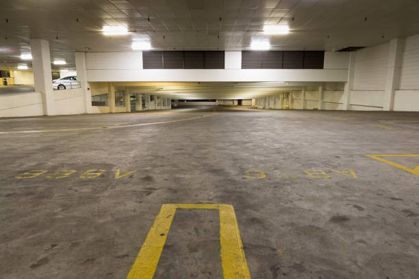 istock Empty Car Parking Garage at night with dirty floor. 642442212