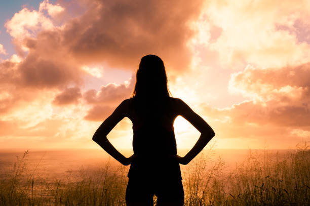 istock Woman watching beautiful sunset 642444742