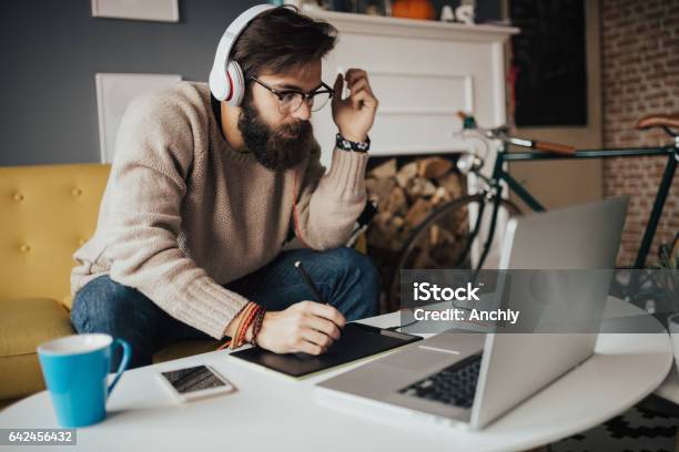 Interior Designer Working From His Cozy Home Office Stock Photo - Download Image Now