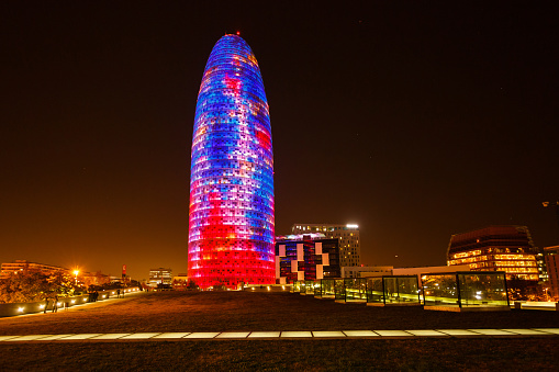 Barcelona, Spain - January 04 2017: Colorful luminous facade of the Agbar tower in the night