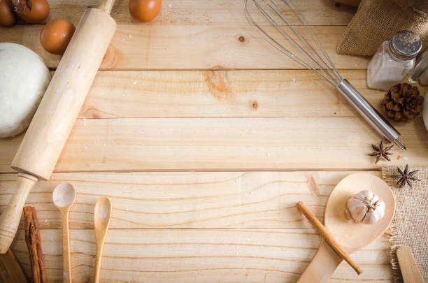 istock Blank wooden table background and bakery ingredients with copy space 642464638