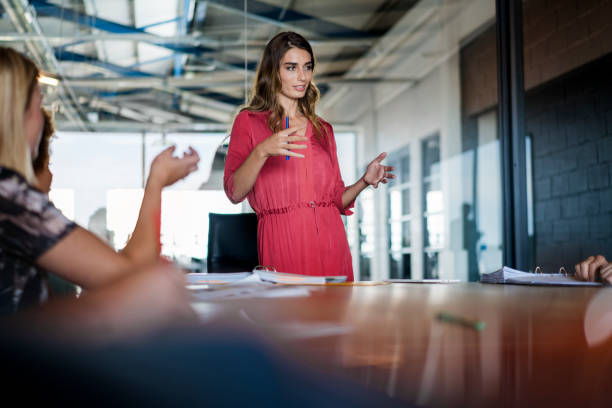 istock Young businesswoman giving presentation in office 642476930