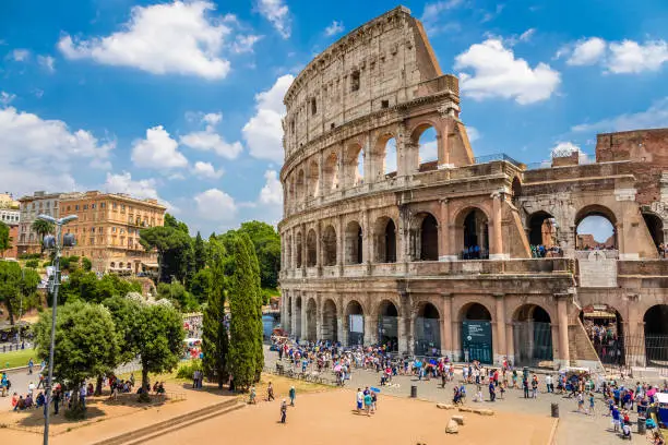 Photo of Colosseum with clear blue sky and clouds, Rome. Panorama