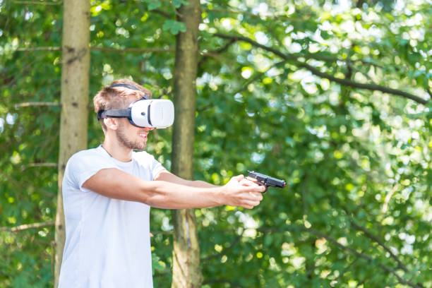 istock Shouting man in virtual reality headset playing video game 642507936