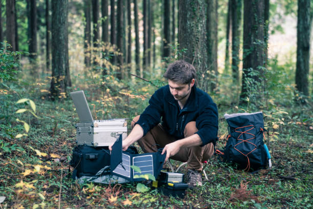 istock Scientist setting up solar powered field laboratory in the forest 642515560