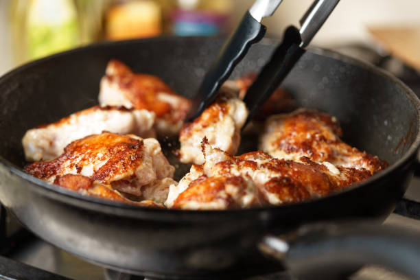 istock Fried Chicken Cooking in an pan closeup 642524342