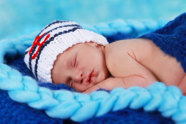 istock Cute newborn baby girl sleeping 642531956