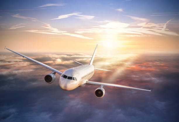 istock Huge airplane flying above clouds in dramatic sunset 642535182
