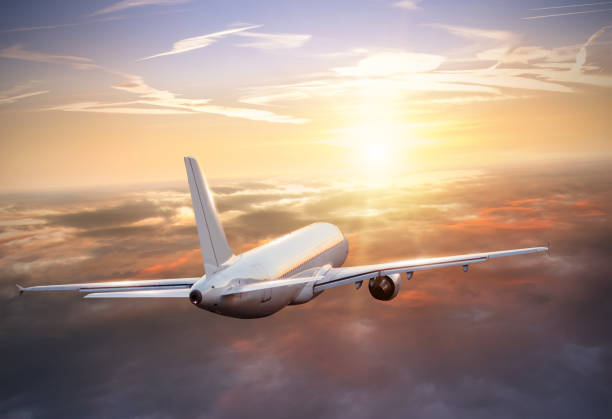 istock Huge airplane flying above clouds in dramatic sunset 642535302