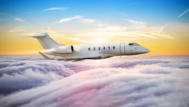istock Huge airplane flying above clouds in dramatic sunset 642535424