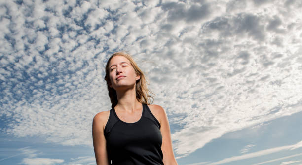 istock Tranquil Woman Breathing in Fresh Air 642536242