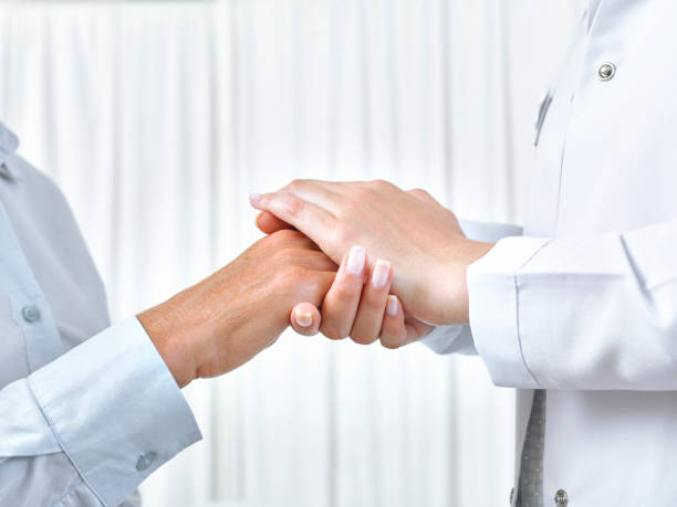 istock Nurse Holding Patient's Hand 642549850