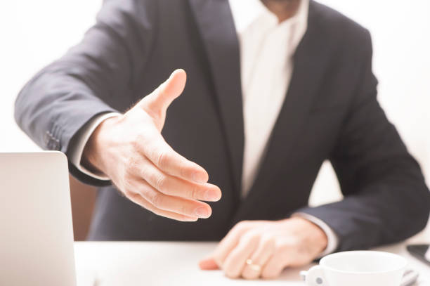 istock Businessman offering his hand for handshake. 642550306