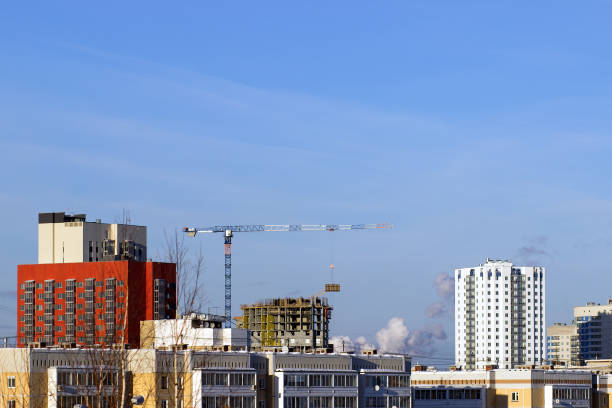 istock Tower cranes on a background of urban development 642553478