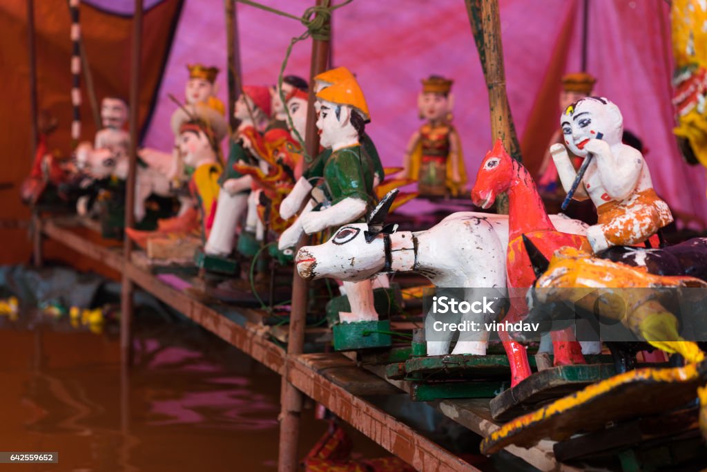 Common Vietnamese water puppets behind puppetry state. The control room is dark to hide puppeteers and instruments Hanoi Stock Photo
