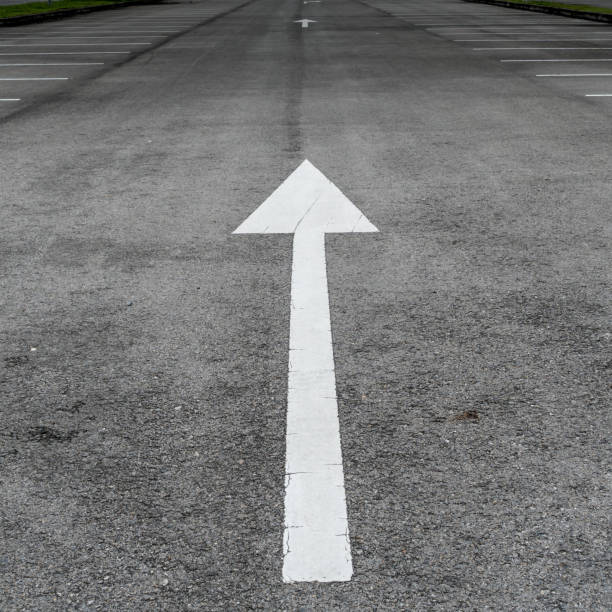 istock Asphalt road with arrow sign 642559966