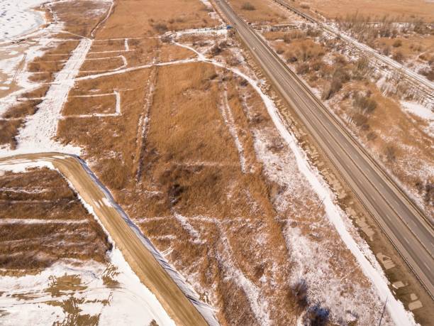 istock Snowy and frozen winter road 642563068
