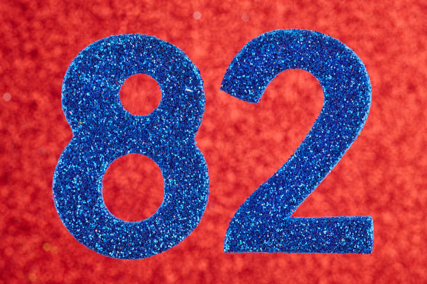 istock Number eighty-two blue color over a red background. Anniversary. 642567070