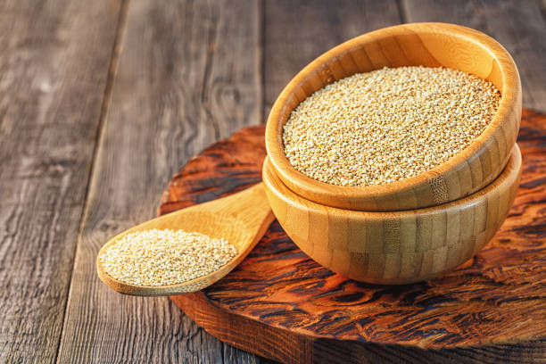 istock White quinoa in a wooden bowl 642588424