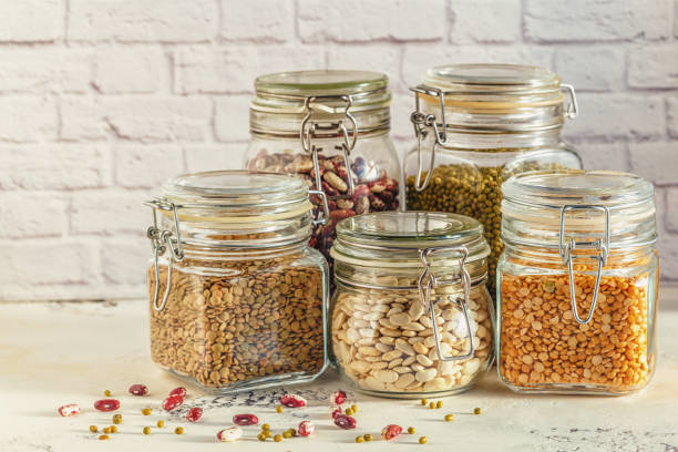 istock Glass jars with various legumes - beans, mung bean, peas and len 642588608