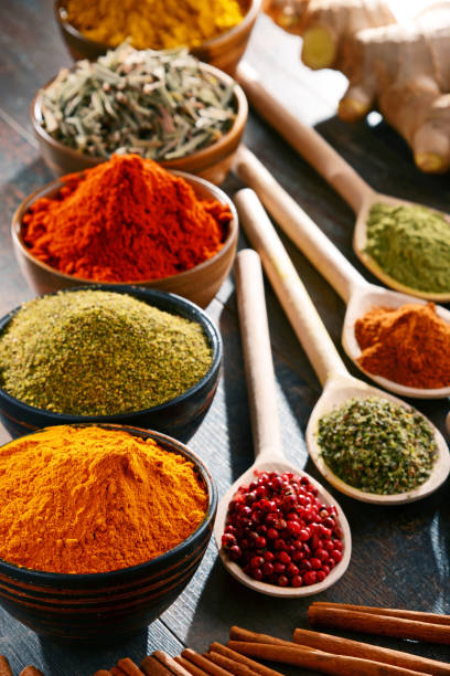 istock Variety of spices and herbs on kitchen table 642592846