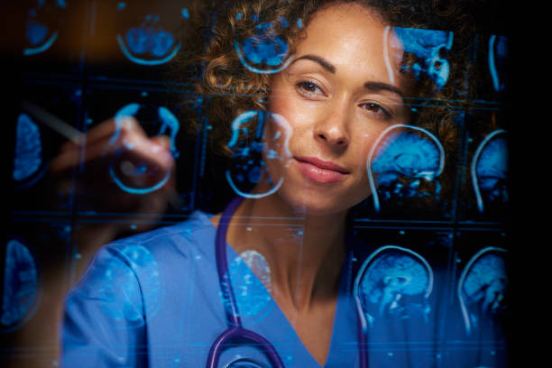 neurosurgeon checking mri scans a female doctor or surgeon is analysing the digitally generated scans of a human brain diagnostic medical tool stock pictures, royalty-free photos & images