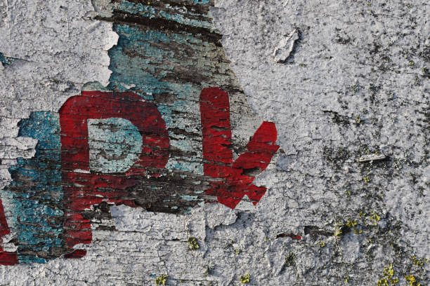 istock Cracked paint craqueleure on weathered car park sign 642595776