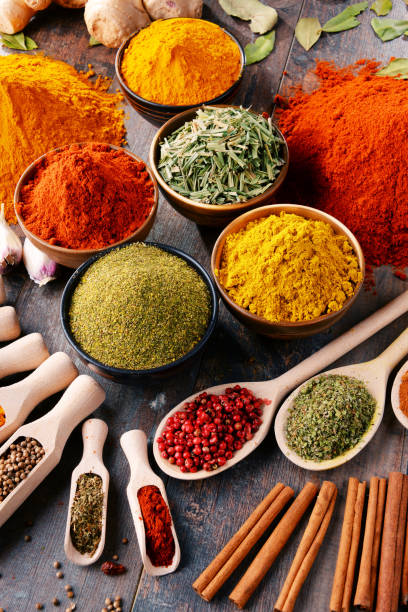 istock Variety of spices and herbs on kitchen table 642598720