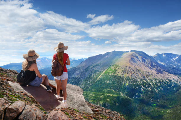 istock Girls enjoying  beautiful summer mountains landscape. 642598794