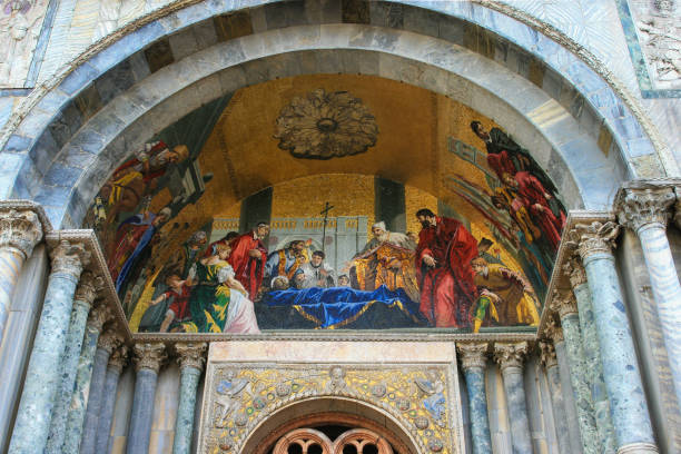 Golden dome mosaic with decorative medallion and biblical scenes in St Mark's Basilica, Venice, Italy, decorated in Byzantine style.