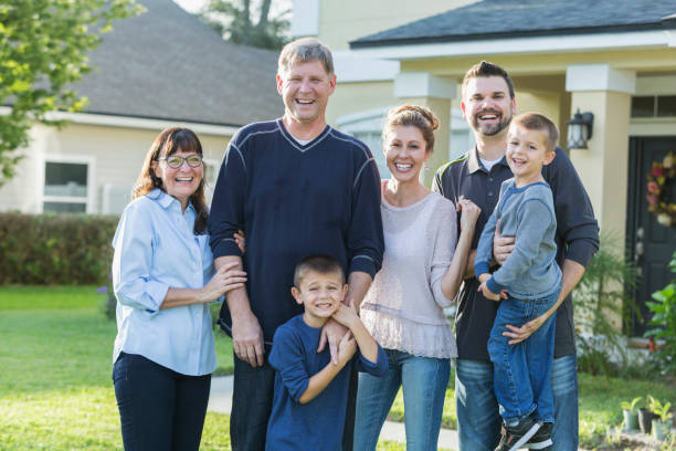 istock Multi-generation family portrait outside house 642612944