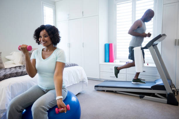 istock Couple exercising in bedroom 642613526