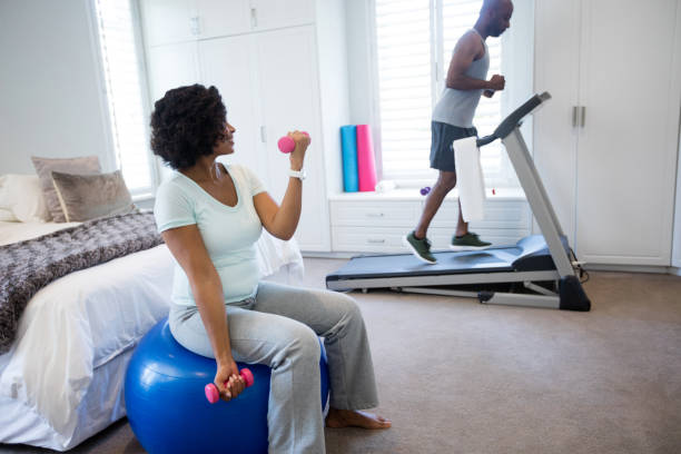 istock Man running on treadmill in bedroom 642613576