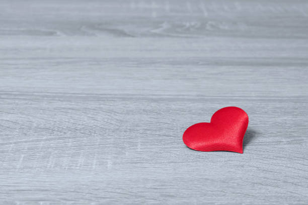 istock Red heart on a gray wooden background. Free space for text 642620320