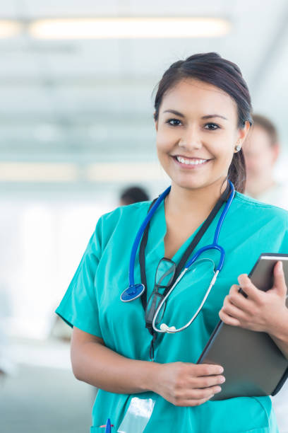 istock Confident young Hispanic nurse in hospital hallway 642622646